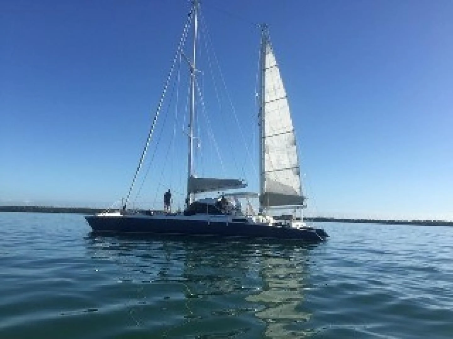 a sailboat on the water aboard BLUE MOON Yacht for Charter