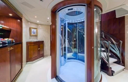 a room with a glass door aboard BLUE MOON Yacht for Charter