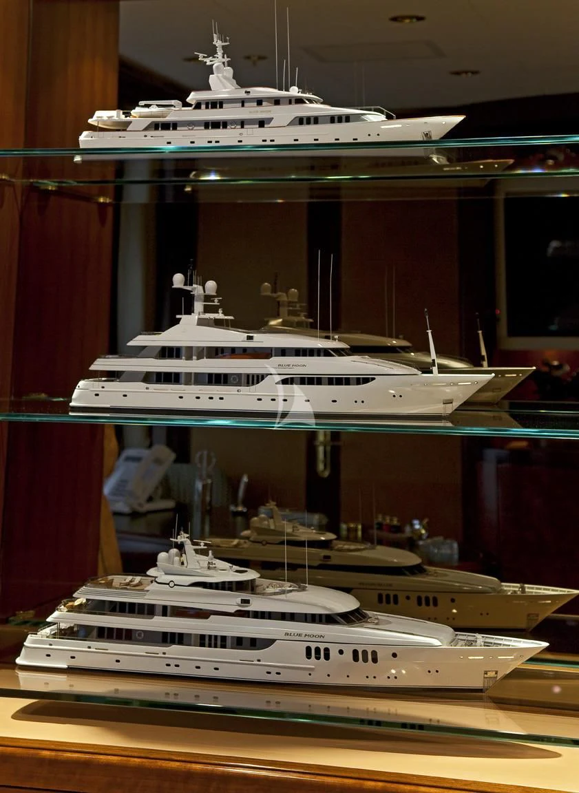 a large white boat in a room aboard BLUE MOON Yacht for Charter