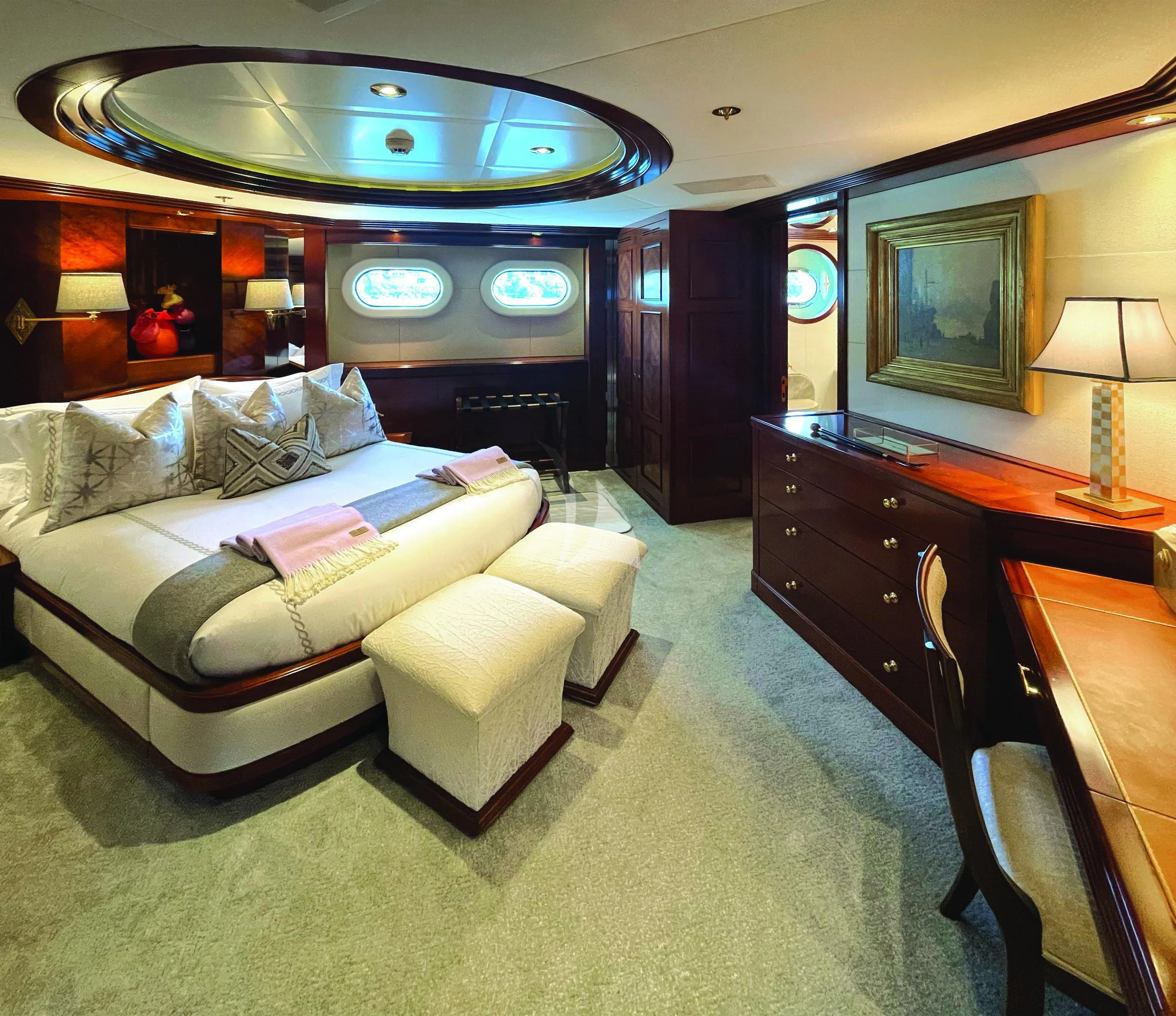 a living room with a couch and a desk aboard BLUE MOON Yacht for Charter