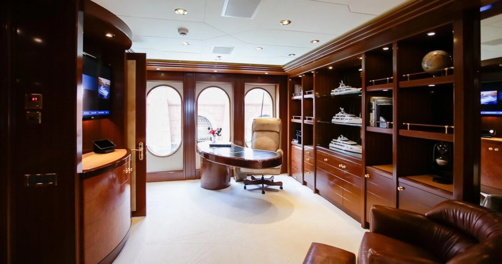 a room with a table and chairs aboard BLUE MOON Yacht for Charter