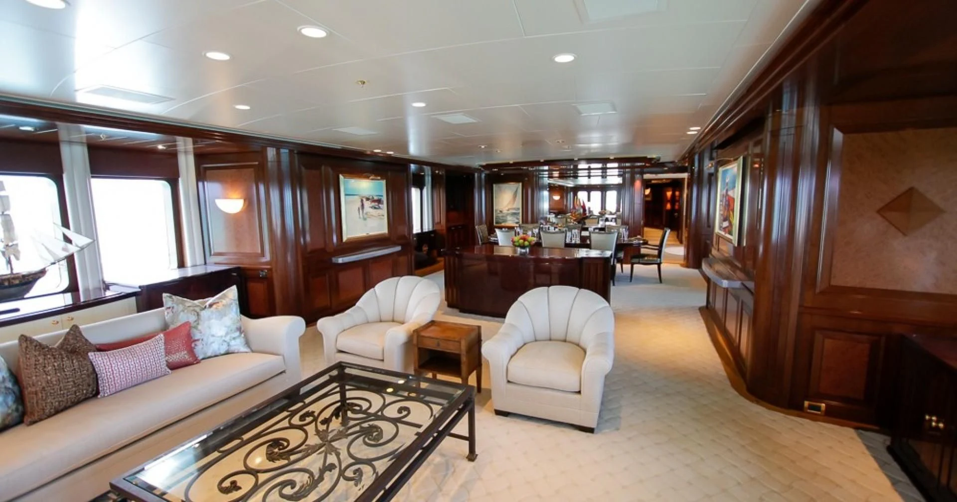 a living room with a couch and a table aboard BLUE MOON Yacht for Charter