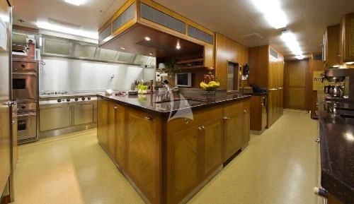 a kitchen with a large island aboard BLUE MOON Yacht for Charter