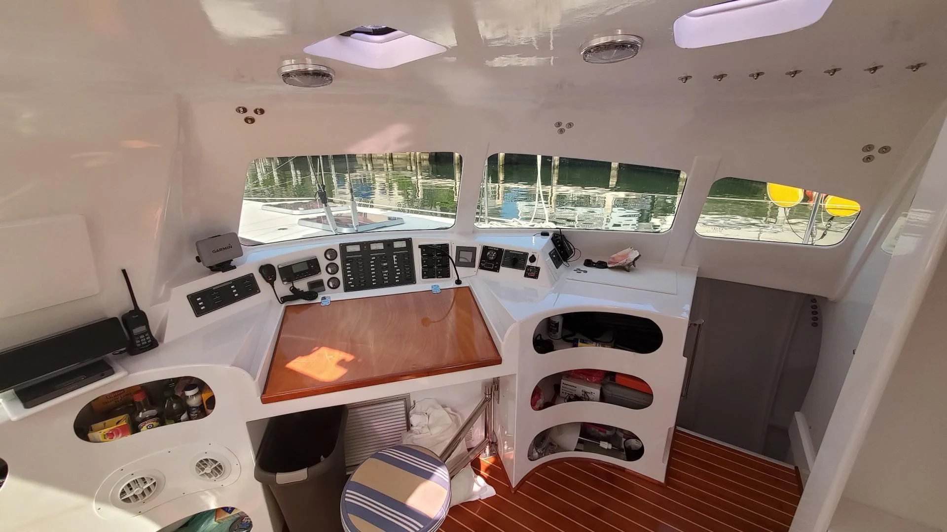 a room with a table and a window aboard BLUE MOON Yacht for Charter