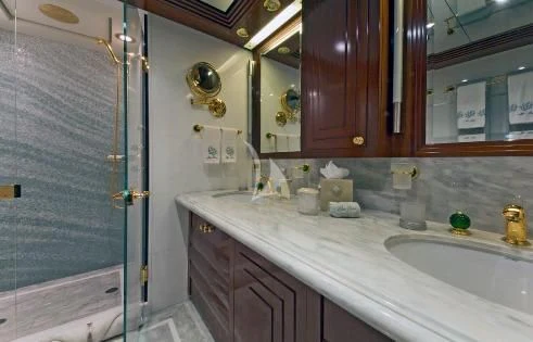 a bathroom with a sink and a shower aboard BLUE MOON Yacht for Charter