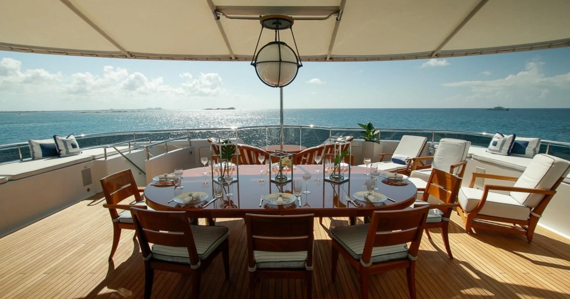 a room with tables and chairs aboard BLUE MOON Yacht for Charter