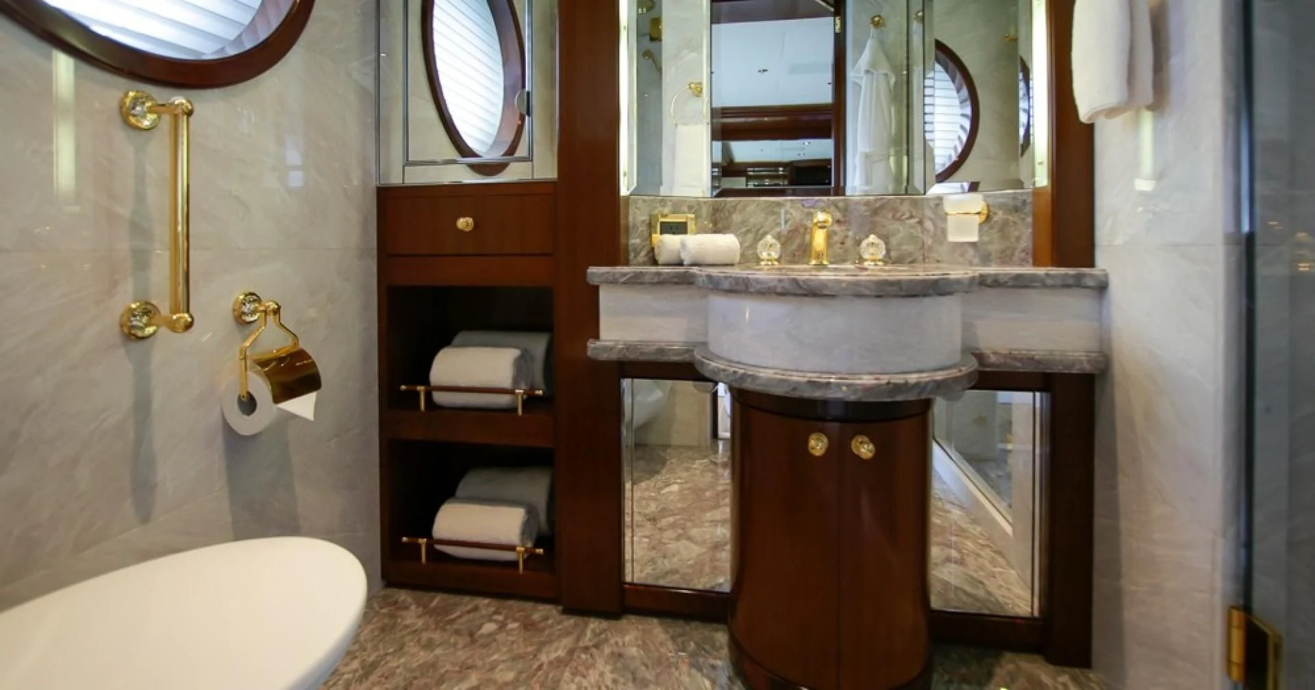 a bathroom with a sink and a mirror aboard BLUE MOON Yacht for Charter