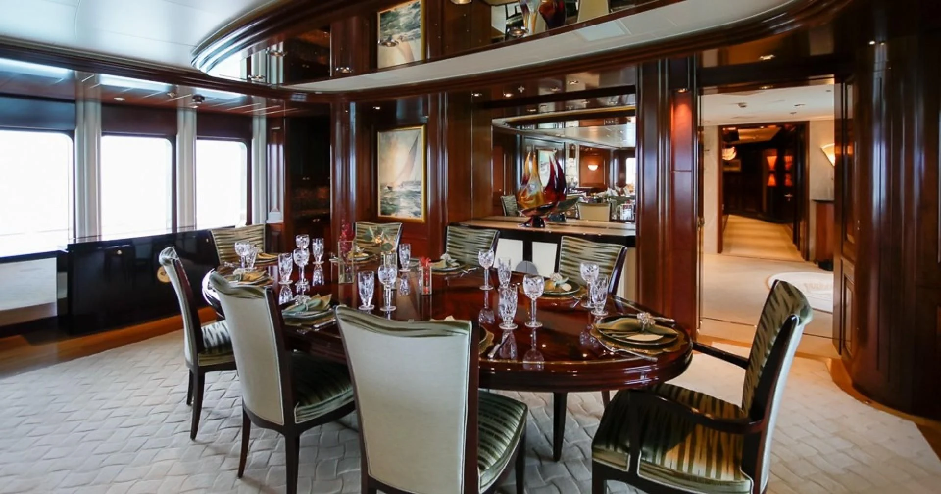 a dining room with a table and chairs aboard BLUE MOON Yacht for Charter