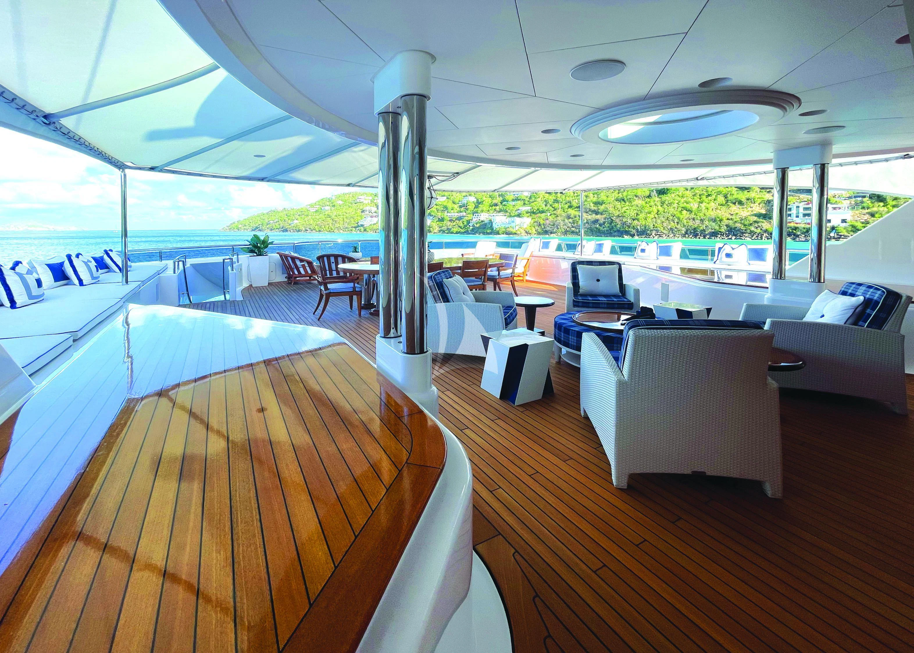a large room with a large deck aboard BLUE MOON Yacht for Charter