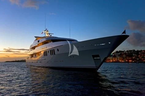 a large white ship on the water aboard BLUE MOON Yacht for Charter