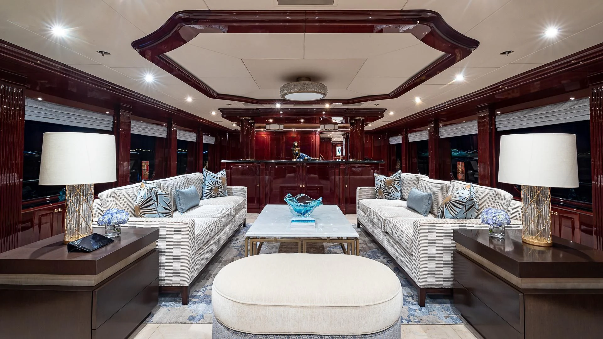 a living room with a large mirror aboard LADY ELAINE Yacht for Charter