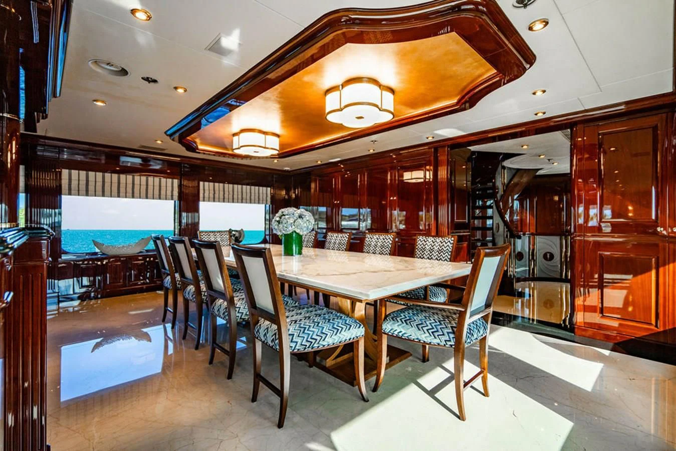 a dining room with a table and chairs aboard LADY ELAINE Yacht for Charter