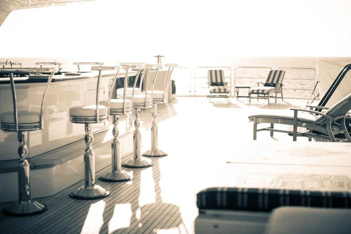 a table with chairs on it aboard LADY ELAINE Yacht for Charter