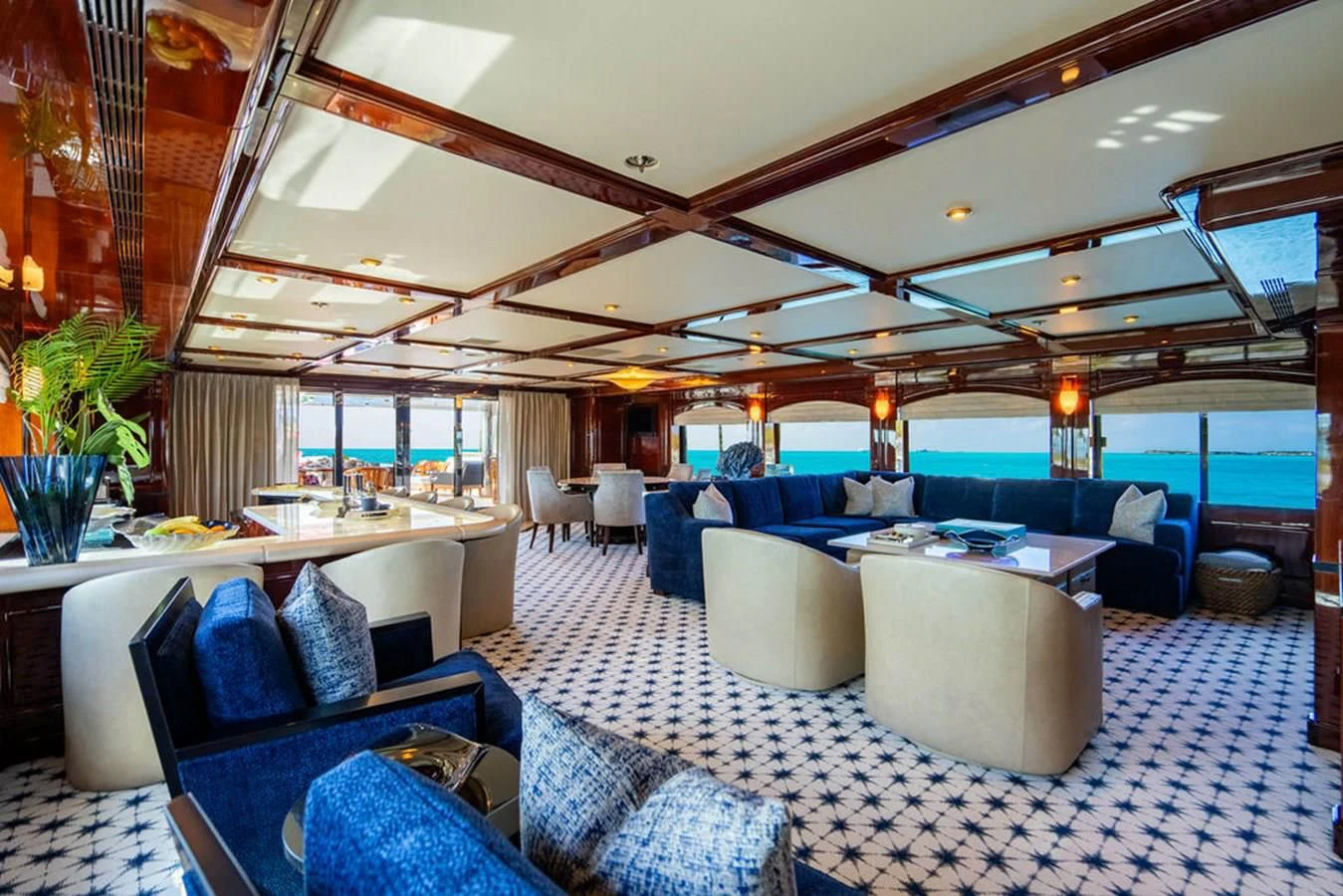 a large room with a couch and a table aboard LADY ELAINE Yacht for Charter