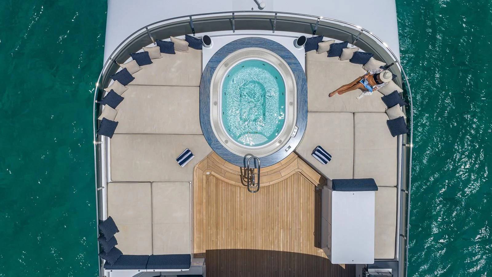 a person standing in front of a podium with a blue circle on it aboard LADY ELAINE Yacht for Charter