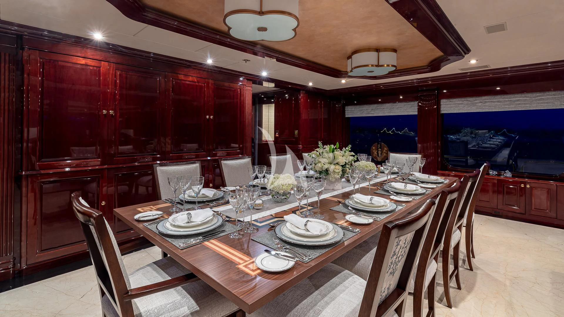 a dining room with a table set aboard LADY ELAINE Yacht for Charter