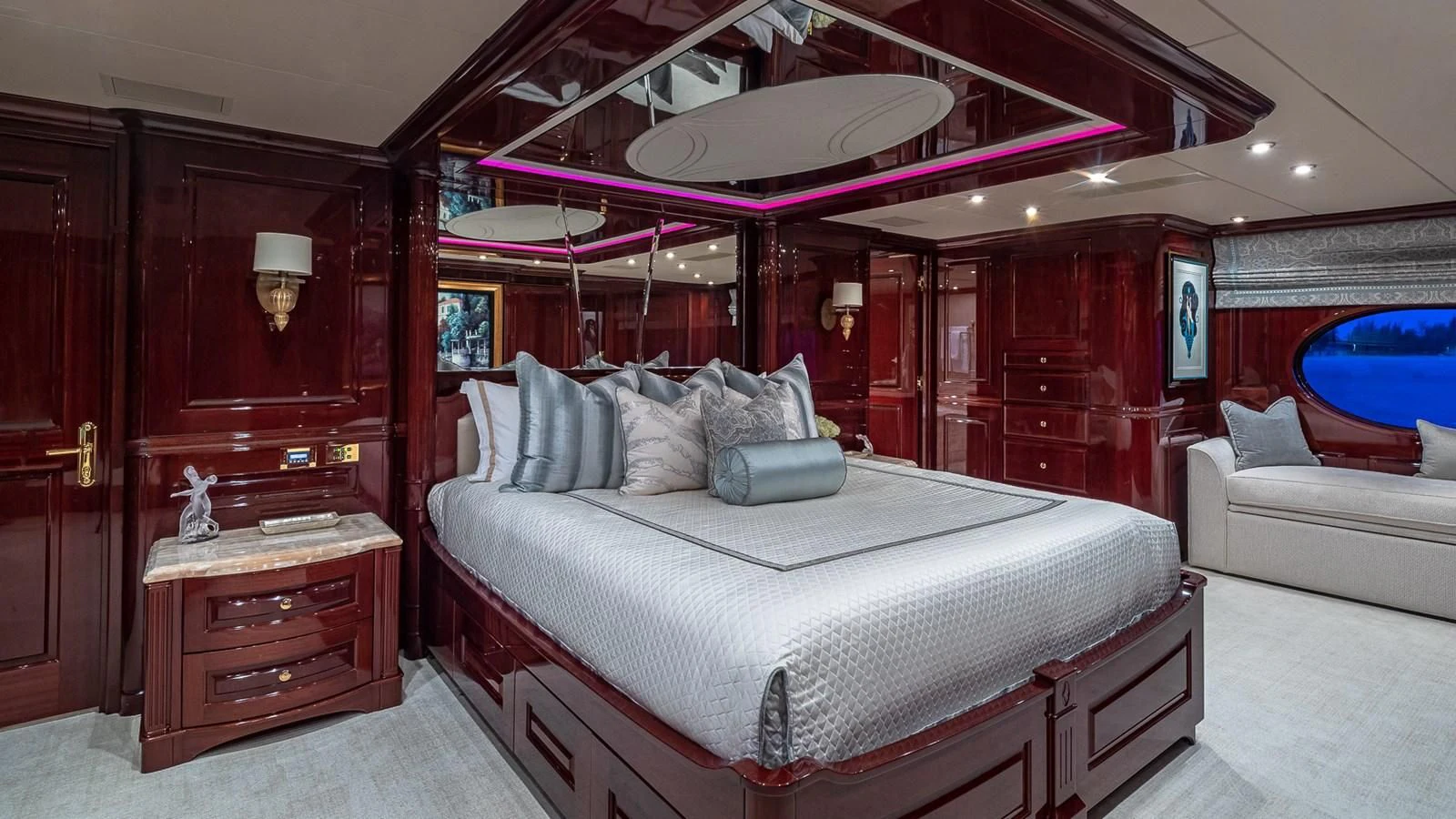 a bedroom with a bed and a lamp aboard LADY ELAINE Yacht for Charter