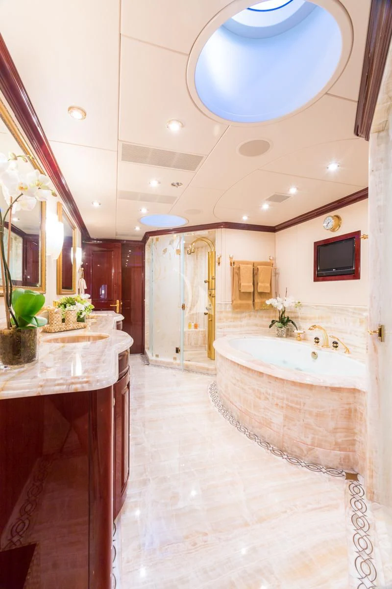 a bathroom with a tub and sink aboard LADY ELAINE Yacht for Charter