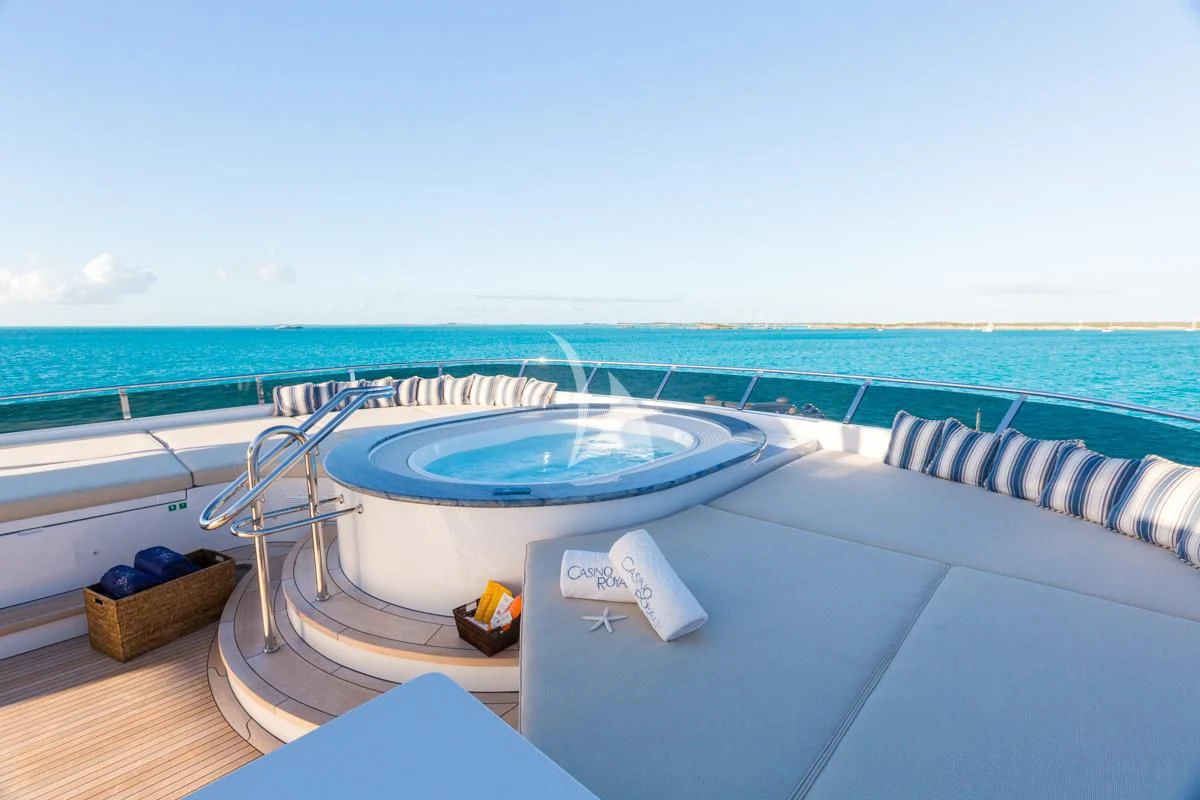a pool with a table and a towel on the deck aboard LADY ELAINE Yacht for Charter