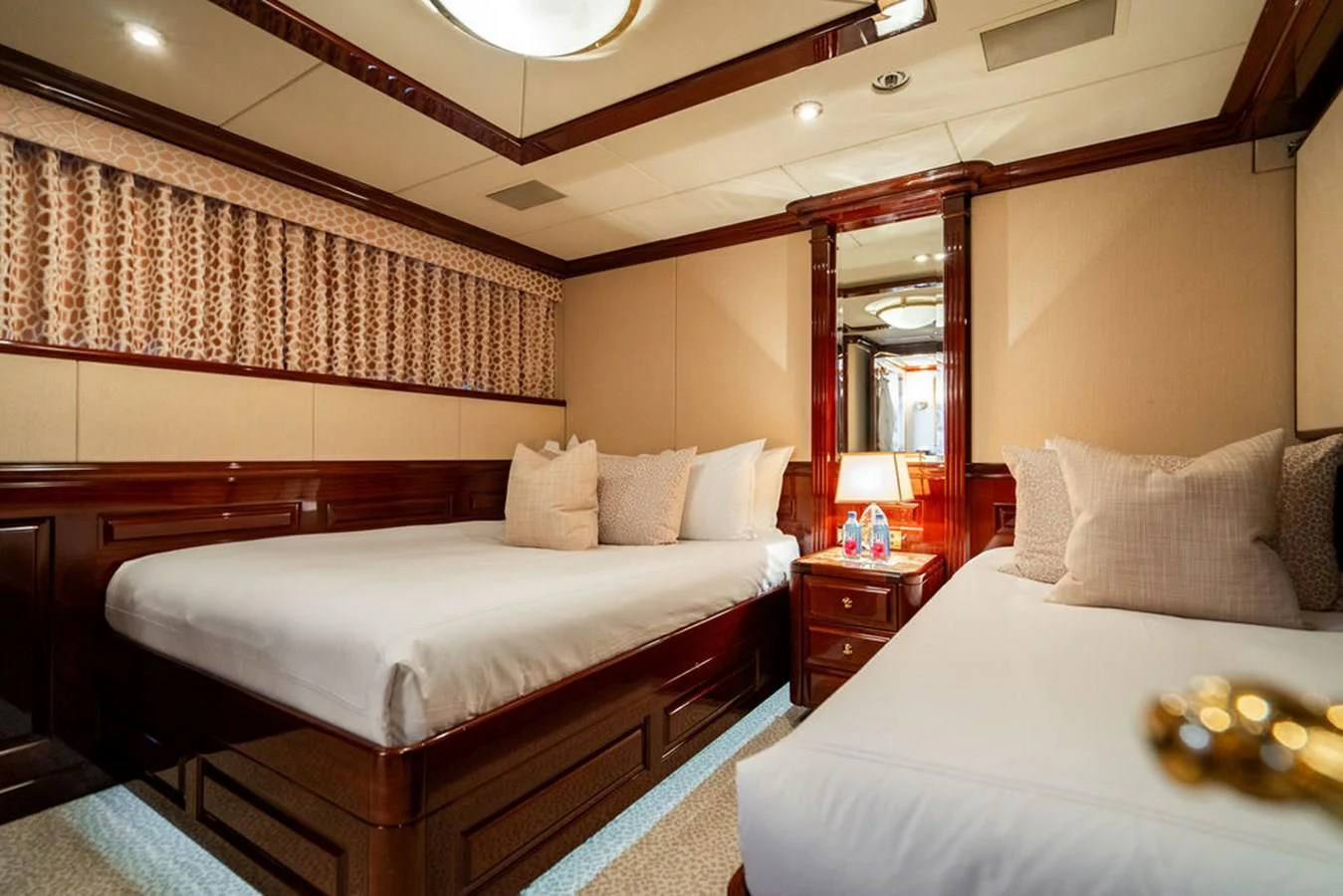 a couple of beds in a hotel room aboard LADY ELAINE Yacht for Charter