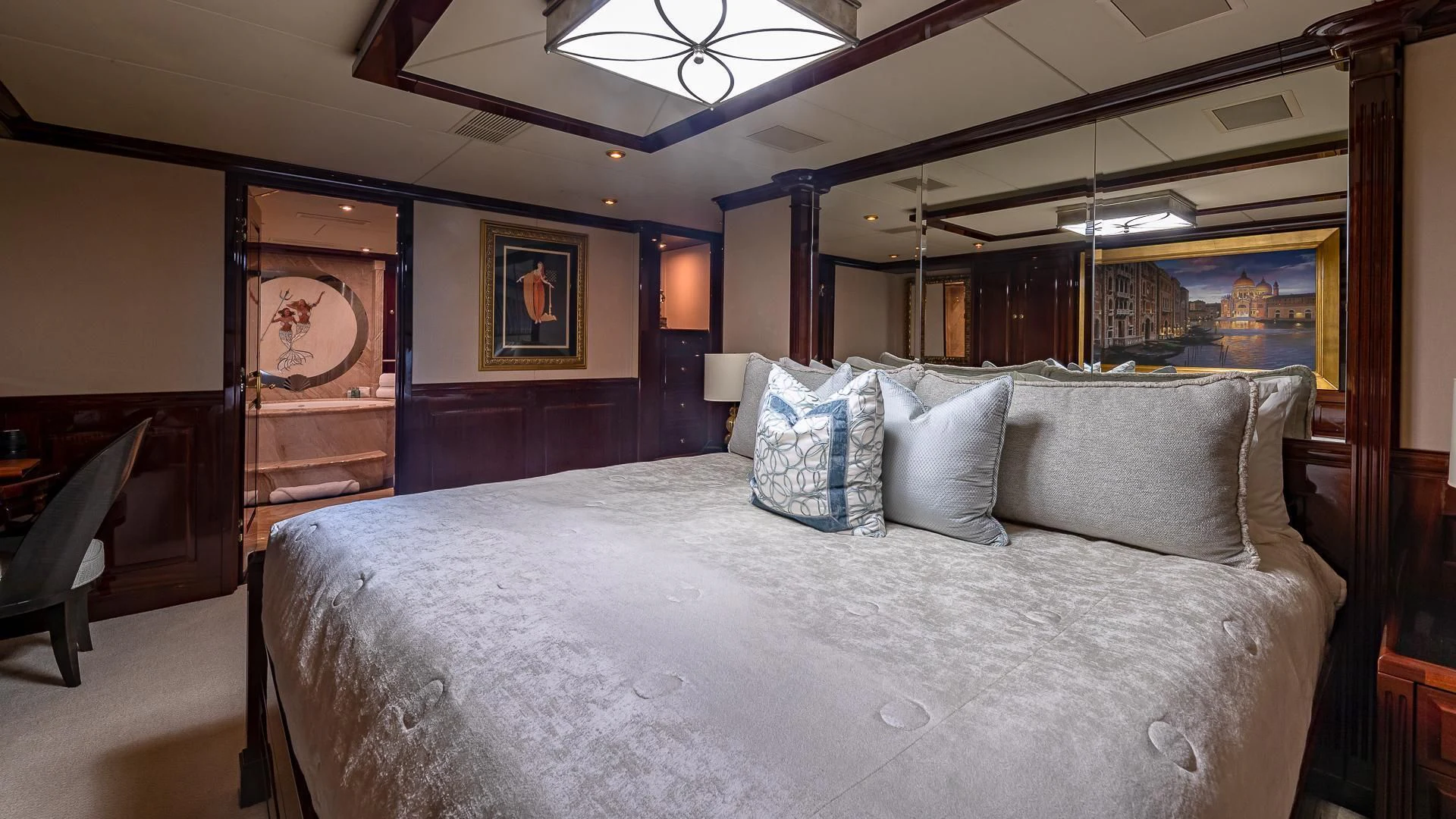 a large bed in a room aboard LADY ELAINE Yacht for Charter