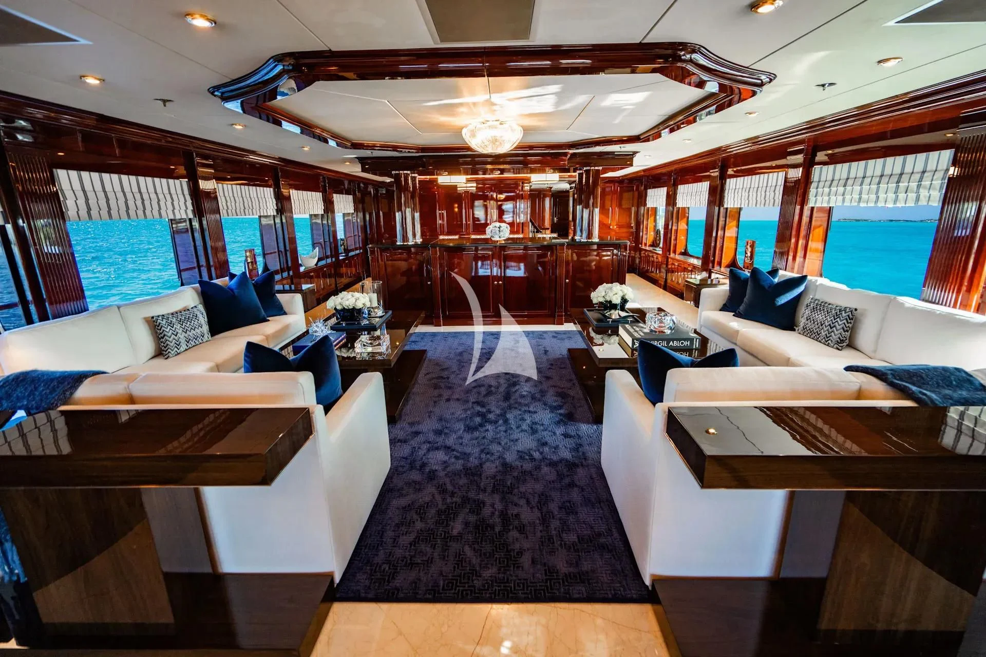 inside of a building with a large window and a large blue rug aboard LADY ELAINE Yacht for Charter
