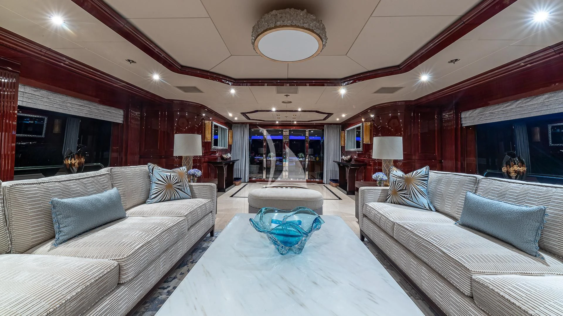 a large living room with a large mirror aboard LADY ELAINE Yacht for Charter