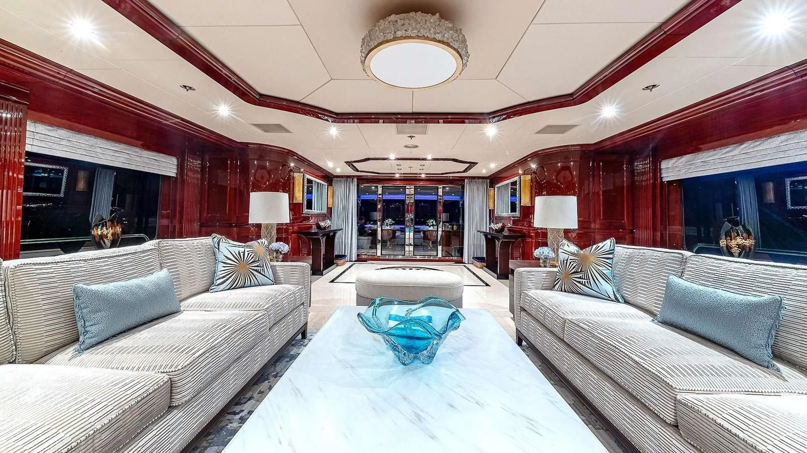 a large living room with a large bed and a large screen aboard LADY ELAINE Yacht for Charter