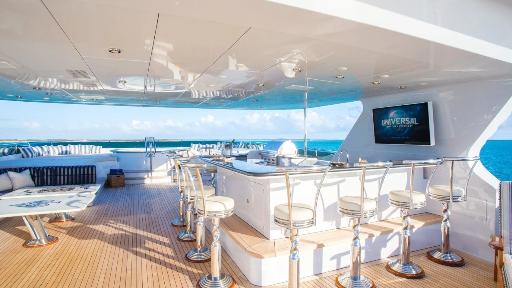 a room with a view of the water and the deck aboard LADY ELAINE Yacht for Charter