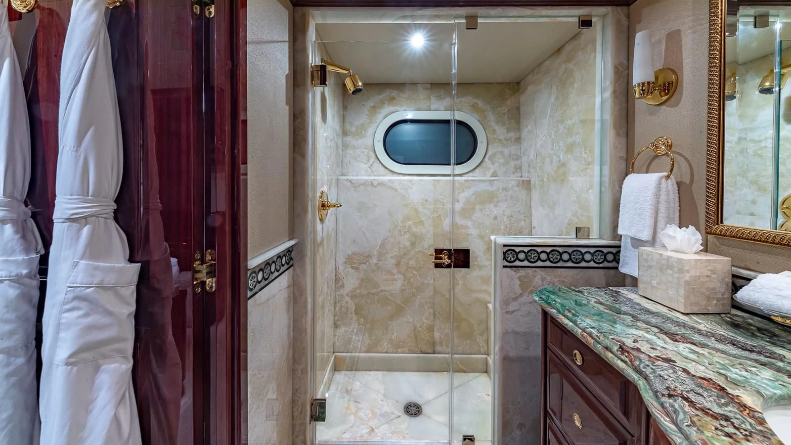 a bathroom with a countertop sink and a mirror aboard LADY ELAINE Yacht for Charter