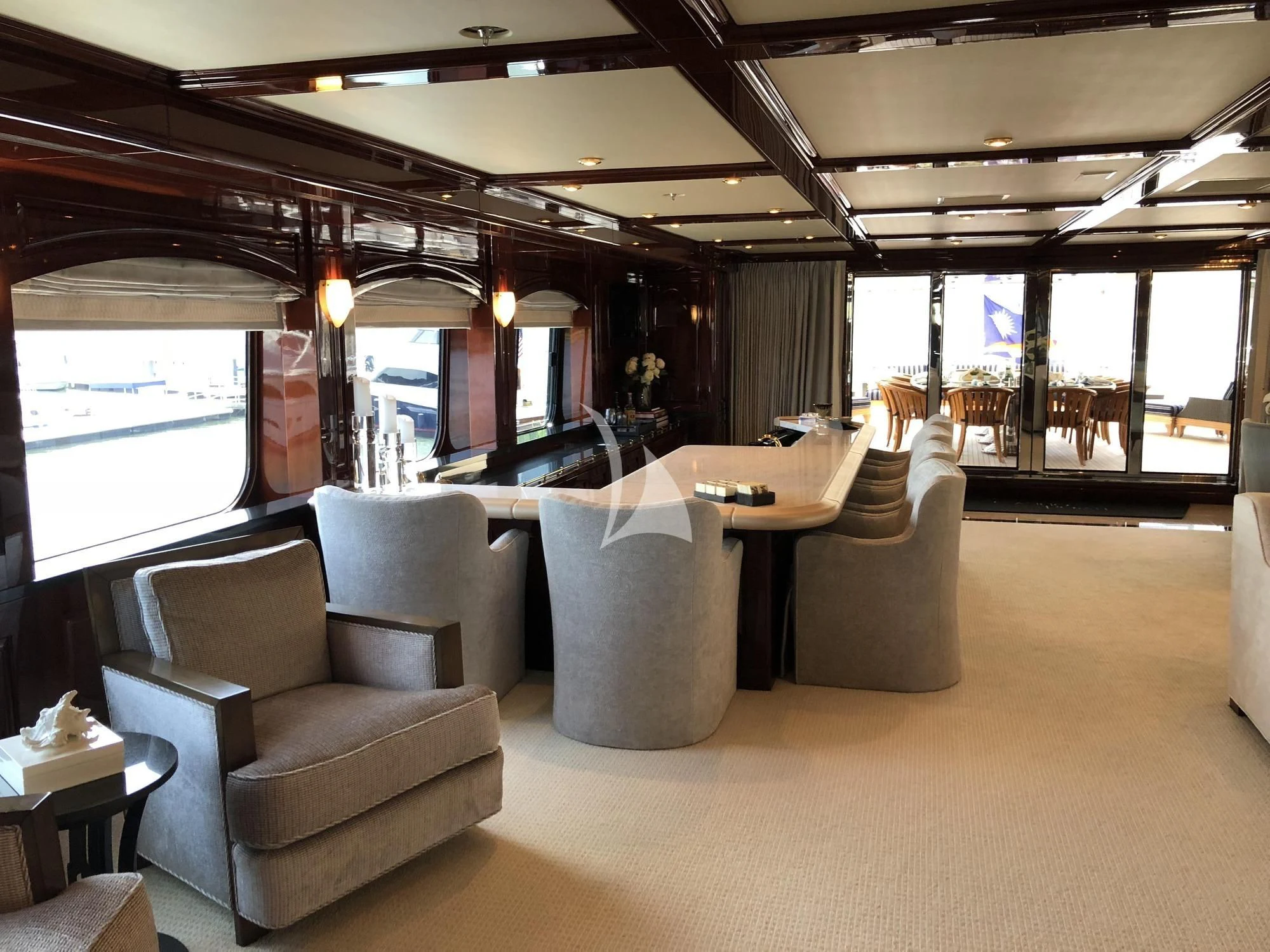 a room with a table chairs and a window aboard LADY ELAINE Yacht for Charter