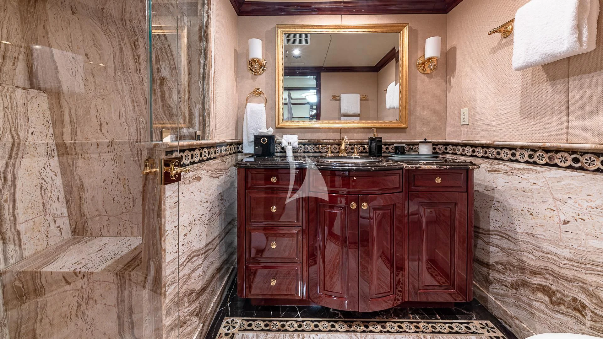 a bathroom with a sink and a mirror aboard LADY ELAINE Yacht for Charter