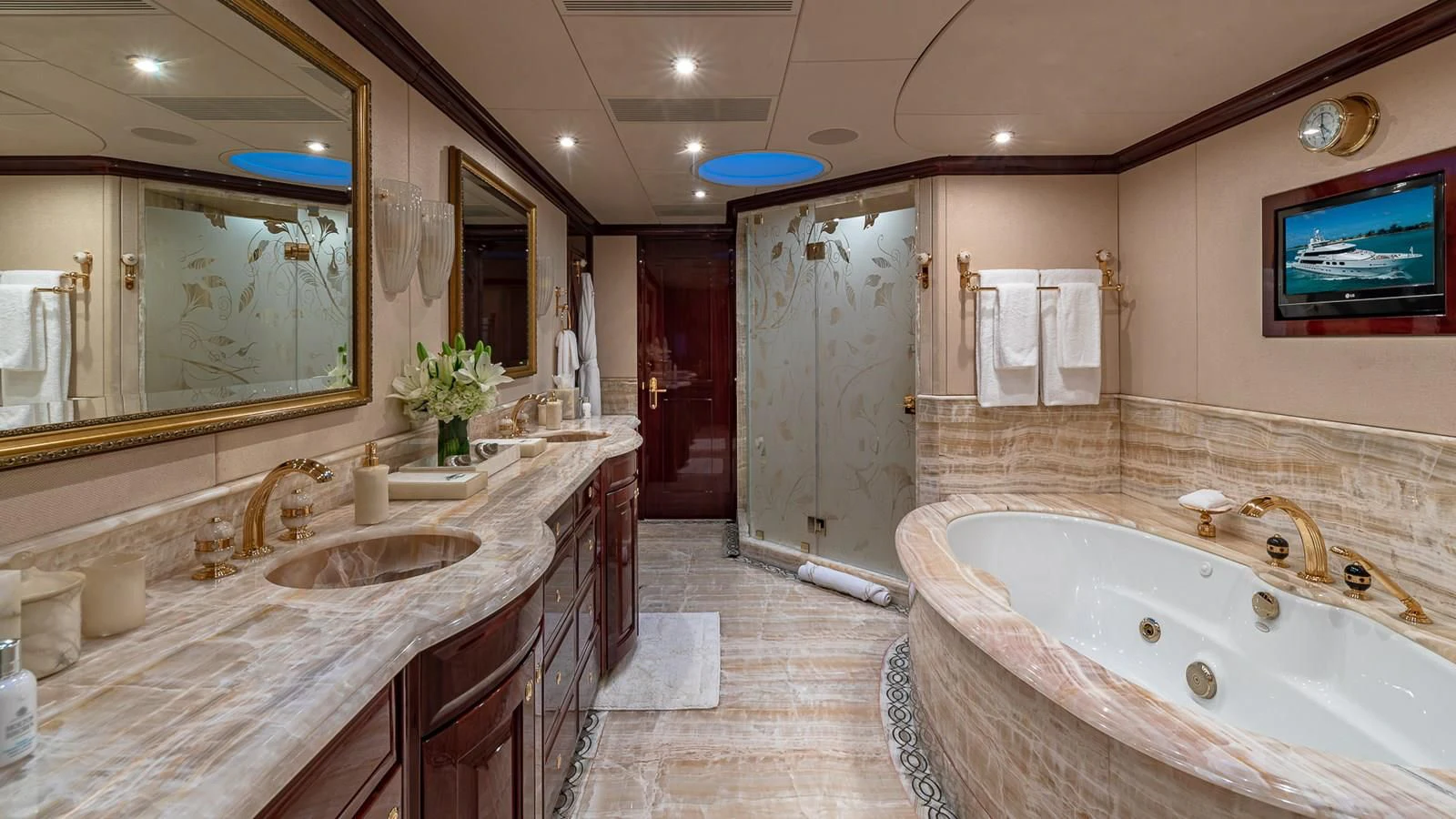 a bathroom with a bathtub and sink aboard LADY ELAINE Yacht for Charter