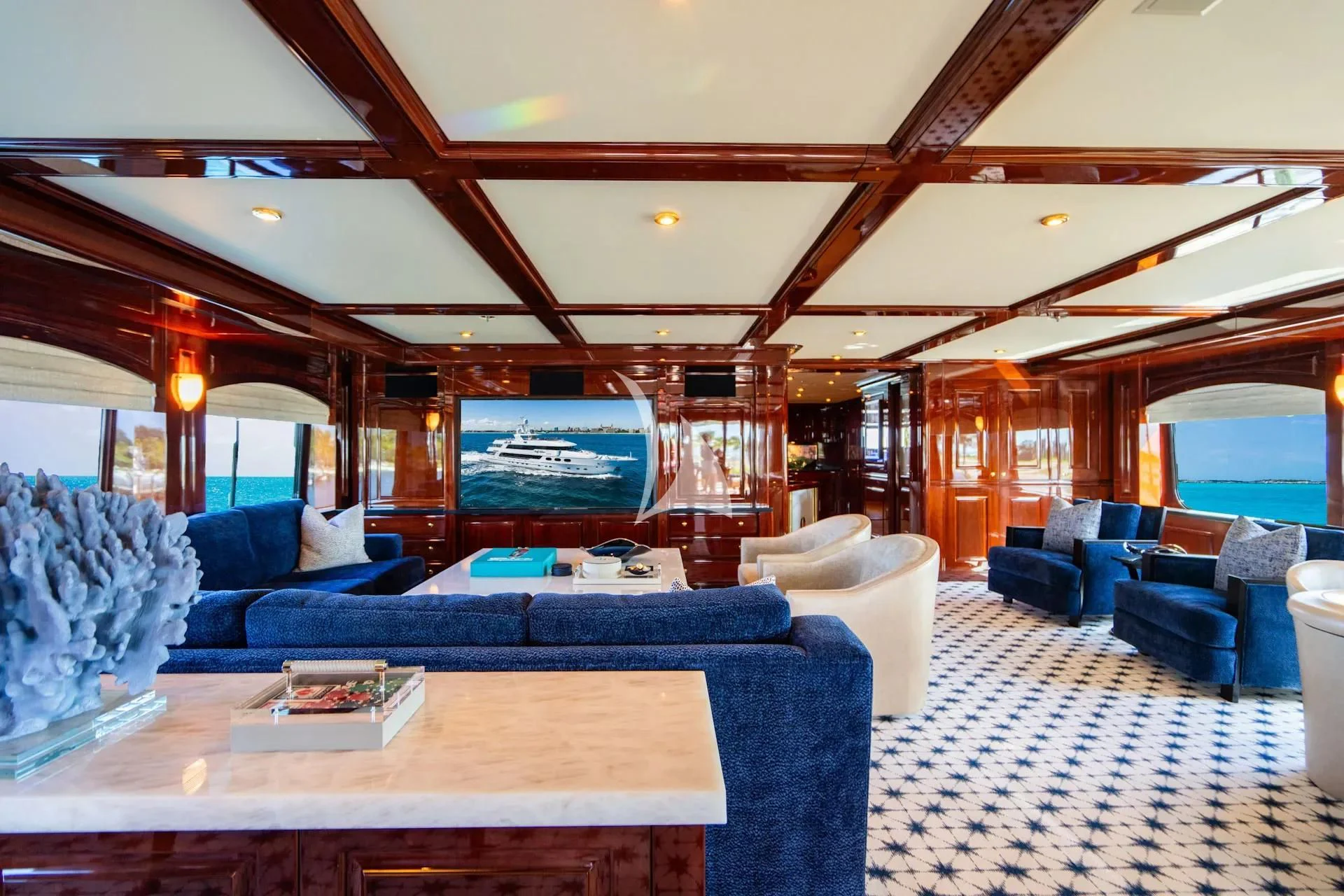 a large living room with a large screen aboard LADY ELAINE Yacht for Charter