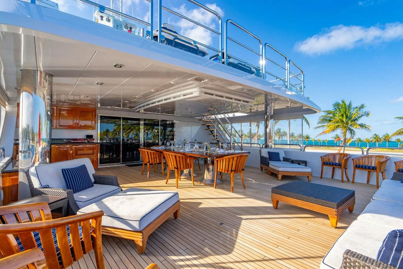 a room with tables and chairs aboard LADY ELAINE Yacht for Charter