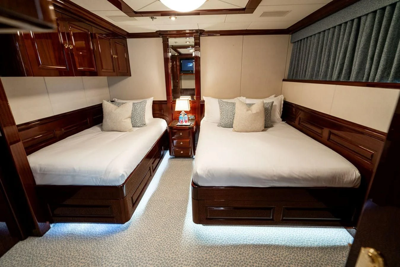 a couple of beds in a hotel room aboard LADY ELAINE Yacht for Charter