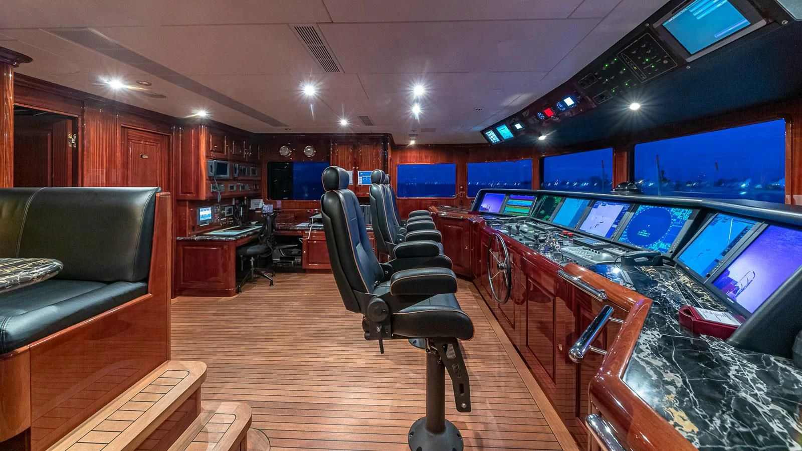 a room with a couch and a piano aboard LADY ELAINE Yacht for Charter