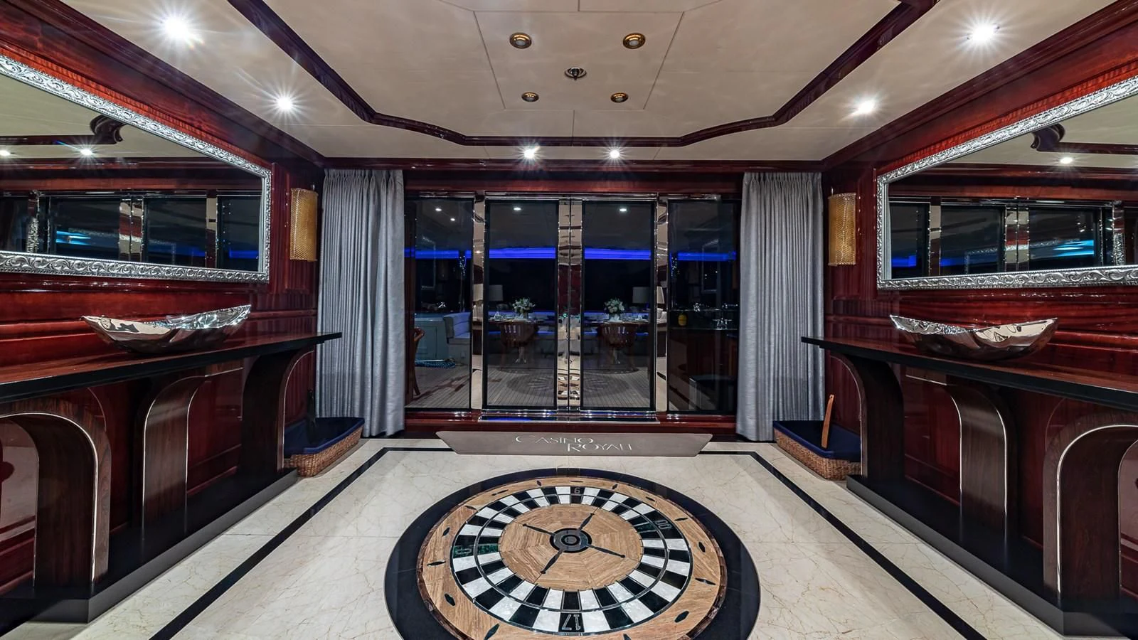 a room with a large mirror and a large window aboard LADY ELAINE Yacht for Charter