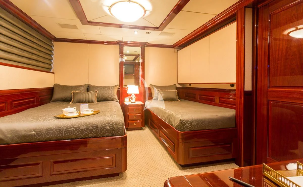 a bedroom with a bed and a couch aboard LADY ELAINE Yacht for Charter