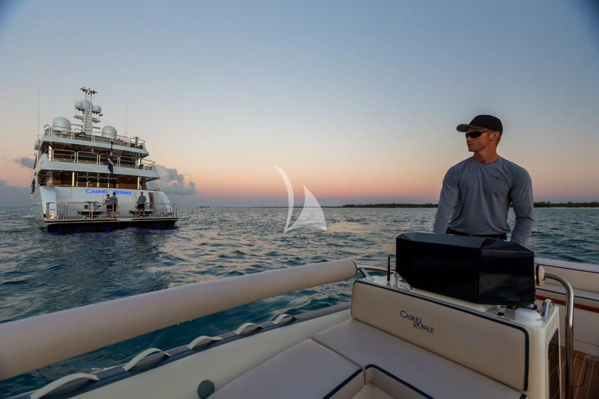 a man standing on a boat aboard LADY ELAINE Yacht for Charter