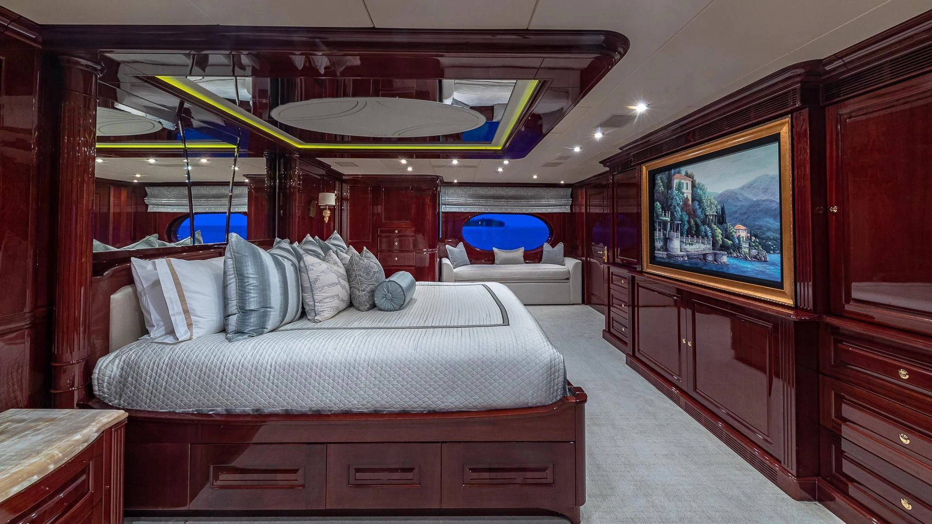 a bedroom with a bed and a television aboard LADY ELAINE Yacht for Charter