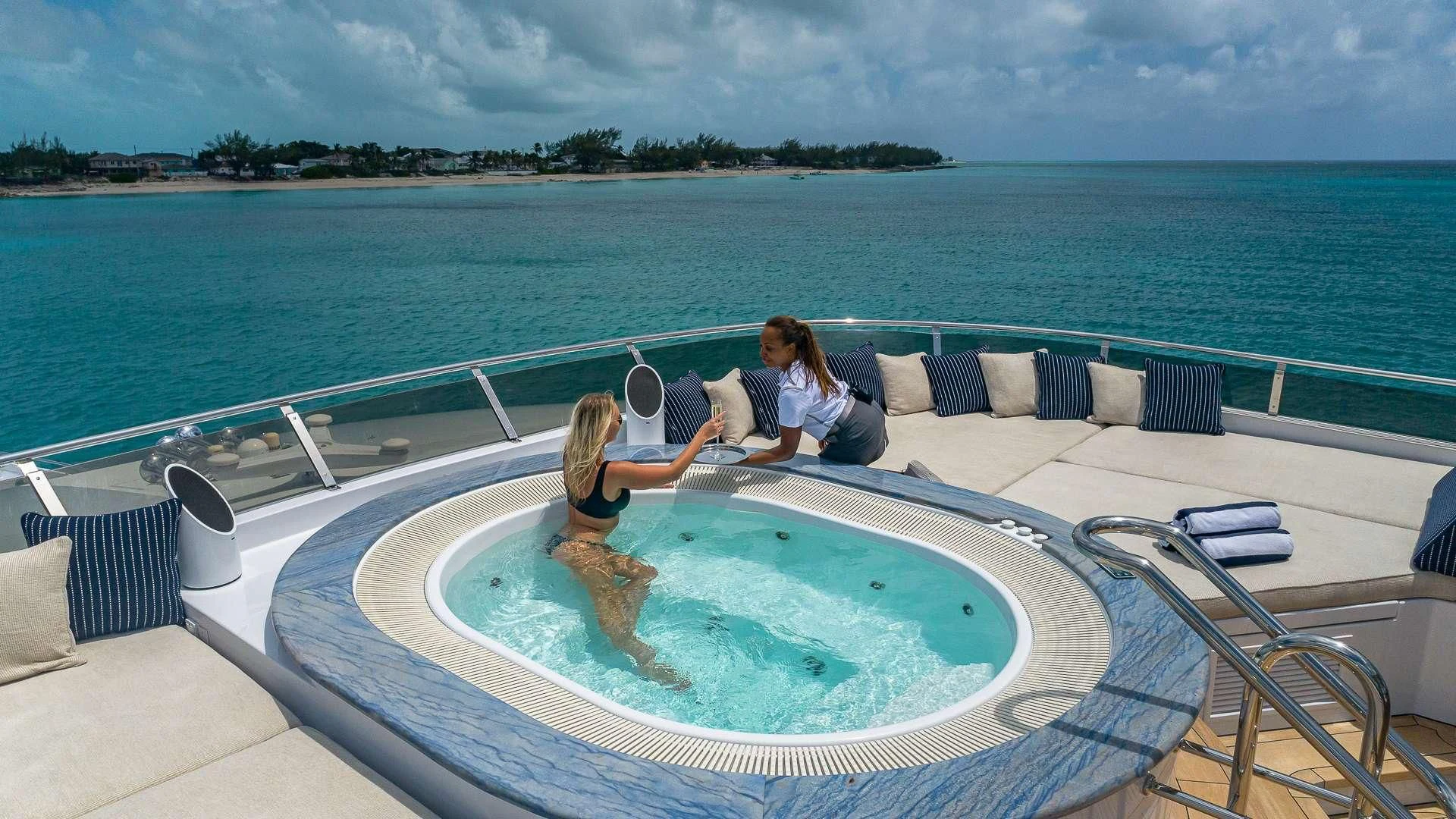 a couple of people sitting on a boat in the water aboard LADY ELAINE Yacht for Charter