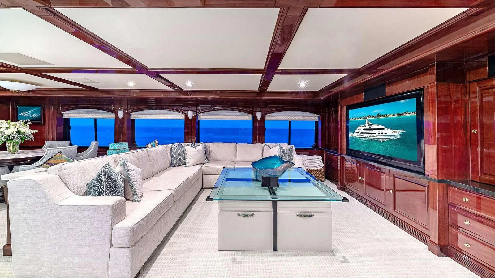 a living room with a large television aboard LADY ELAINE Yacht for Charter