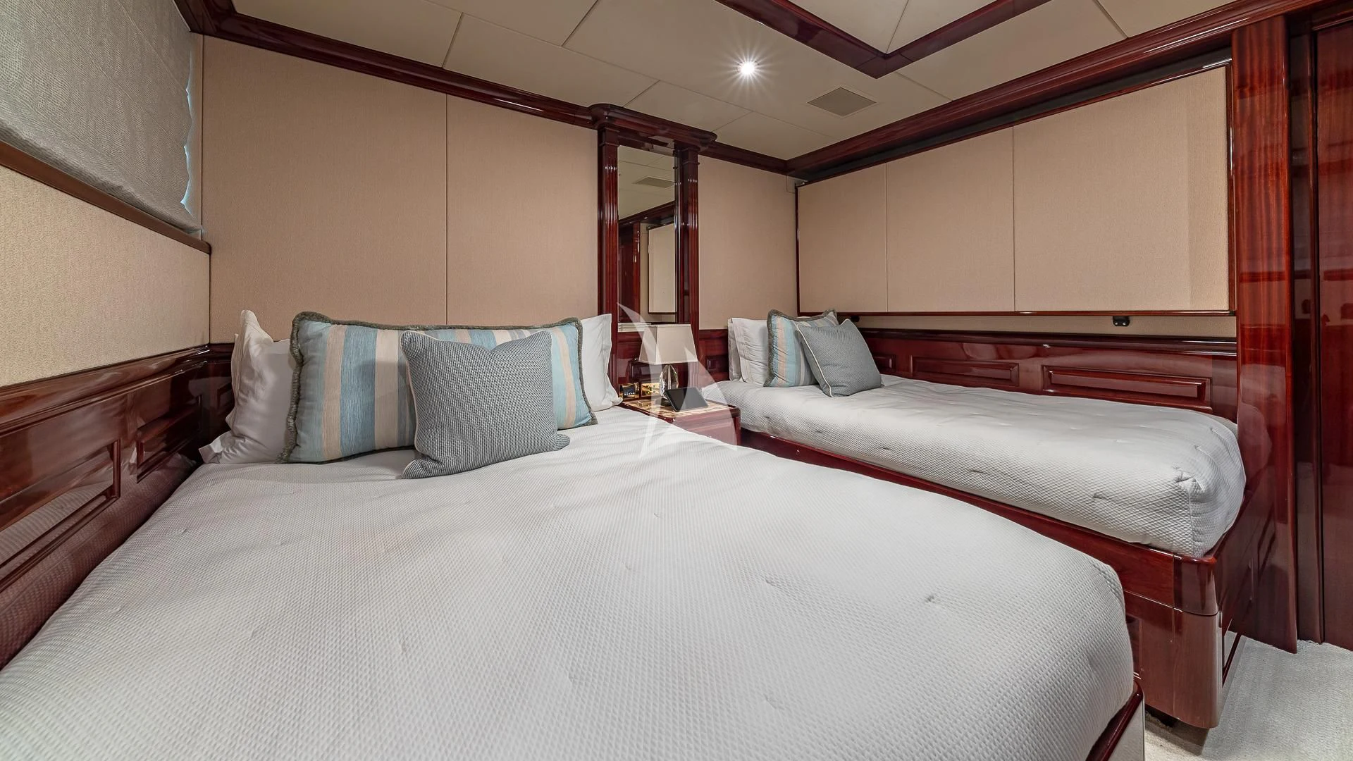 a couple of beds in a room aboard LADY ELAINE Yacht for Charter