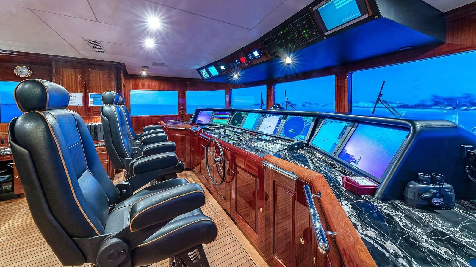 inside of a car with rows of computers and screens aboard LADY ELAINE Yacht for Charter