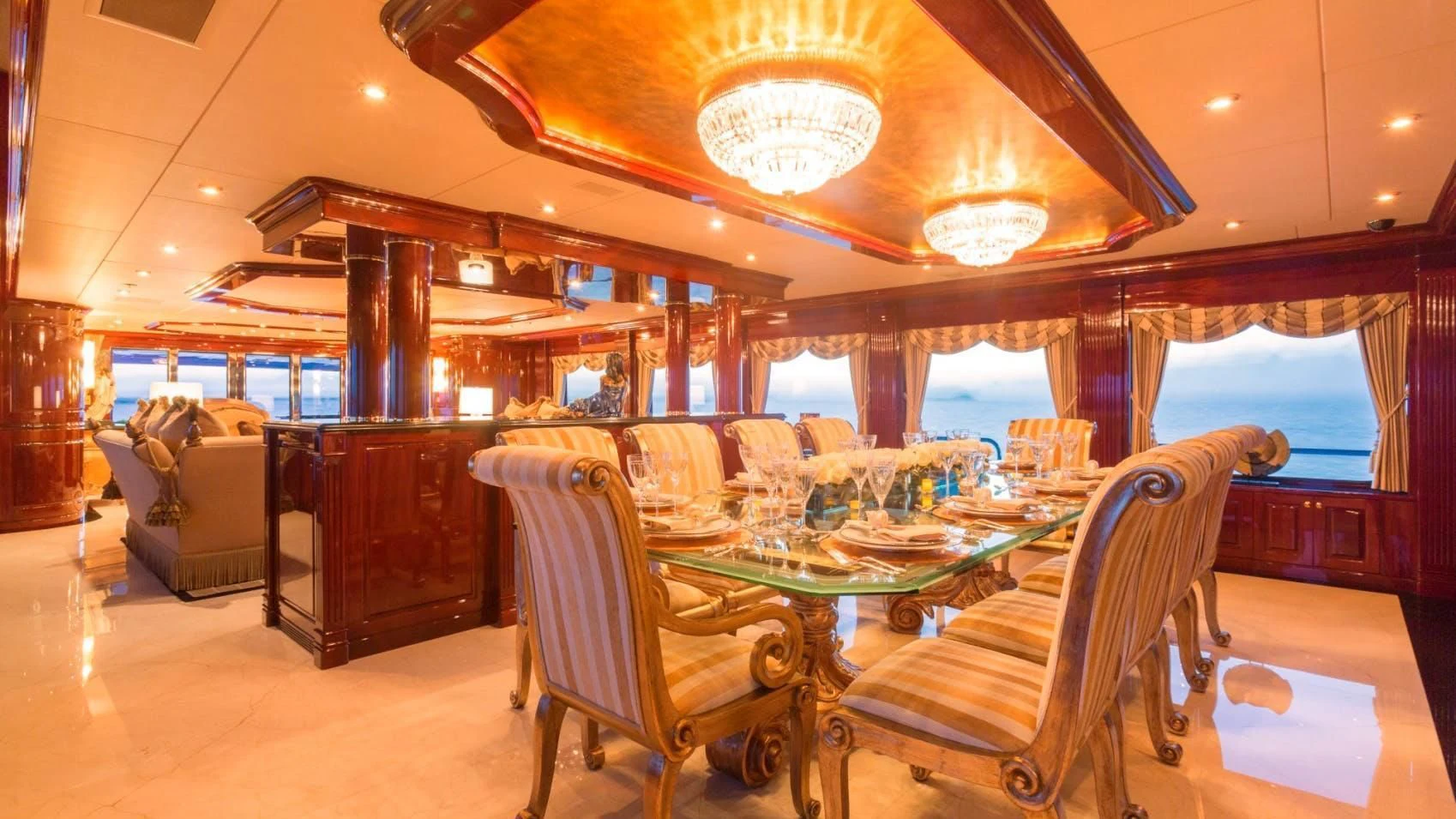 a large room with a table and chairs aboard LADY ELAINE Yacht for Charter
