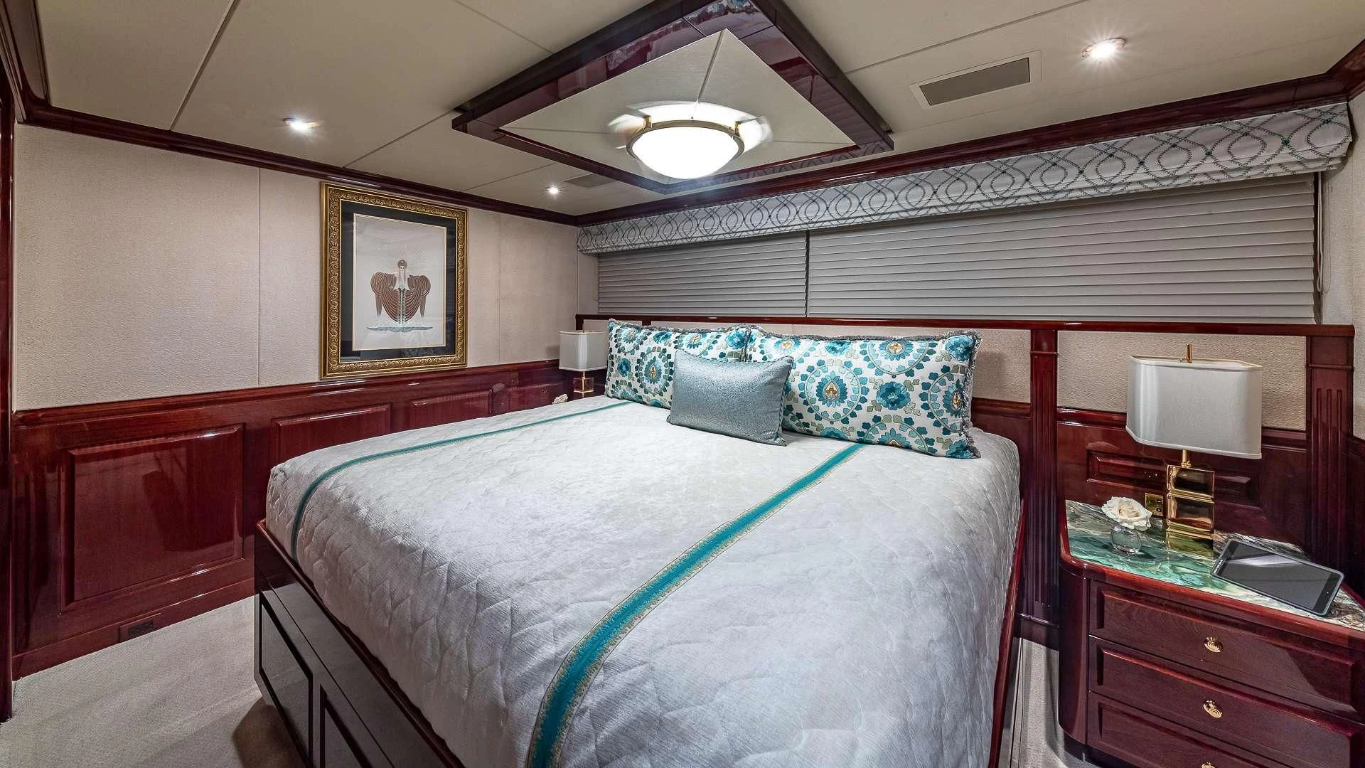 a bedroom with a bed and a desk aboard LADY ELAINE Yacht for Charter