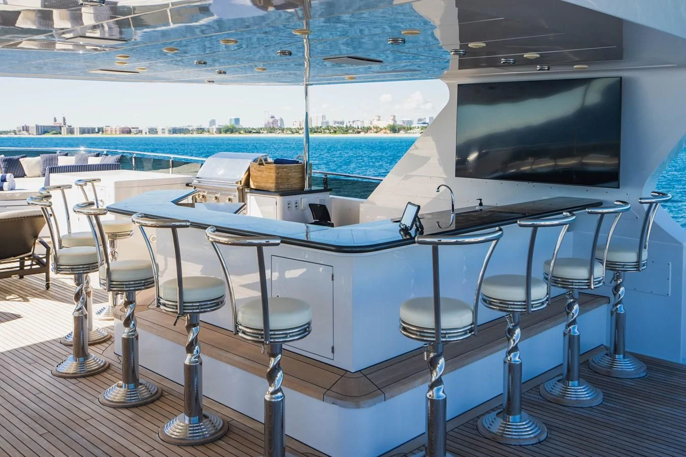 a room with a table chairs and a tv on the wall aboard LADY ELAINE Yacht for Charter