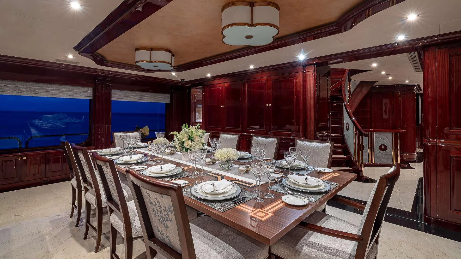 a dining room with tables and chairs aboard LADY ELAINE Yacht for Charter