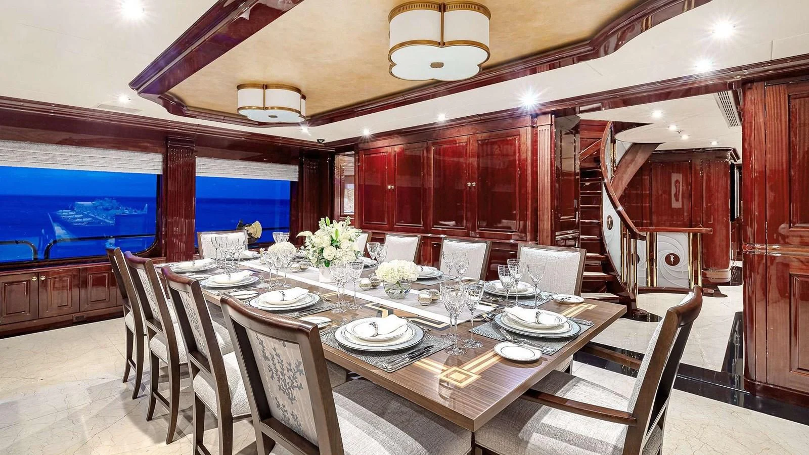a dining room with a table set aboard LADY ELAINE Yacht for Charter